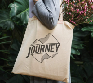 A stylish journey tote bag with sturdy handles, perfect for travel or daily use, featuring a spacious interior and durable fabric.