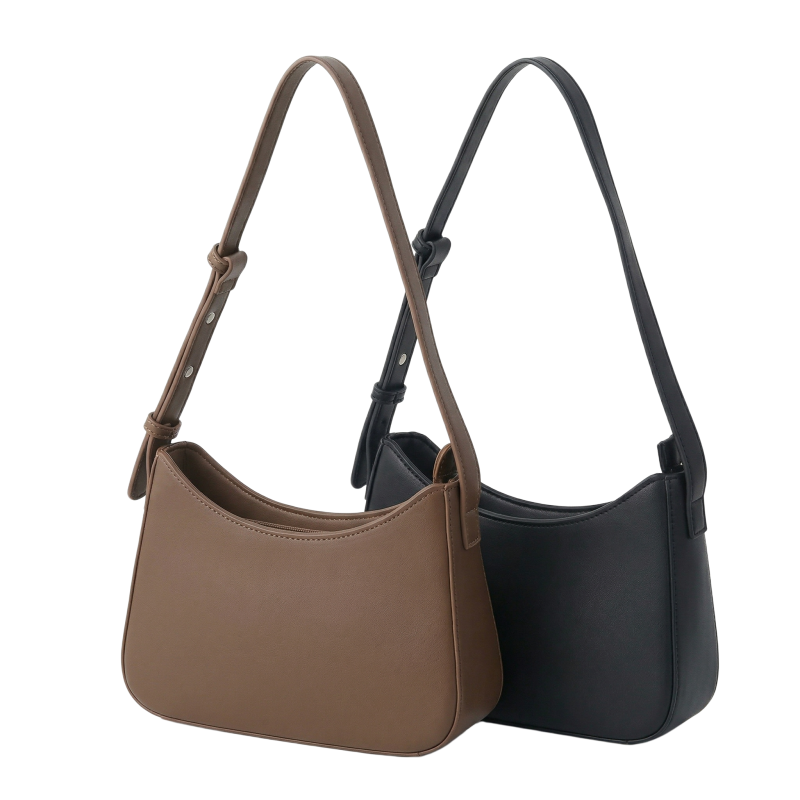 A black leather bag and a brown leather bag, both small, arranged together on a flat surface.